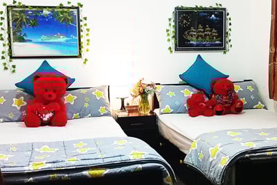 Family room at Nobel Bungalow Nuwara Eliya with double beds and teddy bears – cozy for families