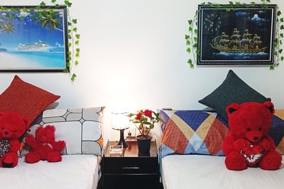 Family room at Nobel Bungalow Nuwara Eliya with wall art, soft lighting, and red teddy bears