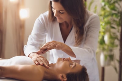 Lady preforming Angelic Reiki at clients home