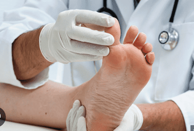 a doctor's testing the patient's foot