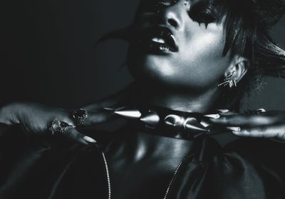 african american woman with large spiked collar for BDSM/bondage