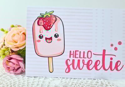 Cute card featuring a smiling pink popsicle with strawberry topping next to the text "Hello Sweetie"