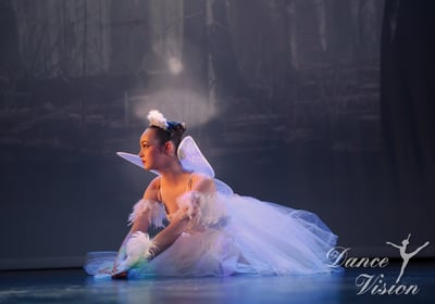 a young girl in a white dress and a white dress