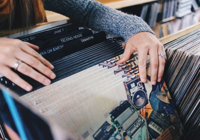 Someone browsing through vinyl records