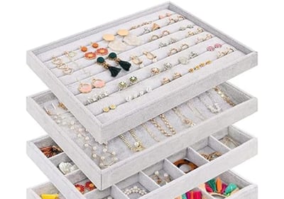 a stack of jewelry with a variety of jewelry
