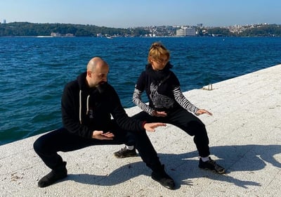 Ismet Himmet and Mine Şilliler practicing Tai Ji stances on the Bosphorus shore in Istanbul.