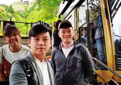 Taking the cable car ropeway up peak of Mount Tenjo
