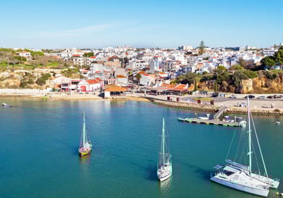 View of Alvor village with its marina filled with boats