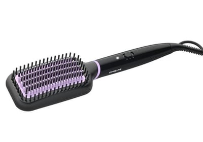 a hair brush with a purple and black brush
