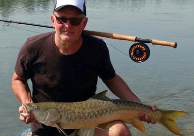 Catching Himalayan Golden Mahseer on the fly.