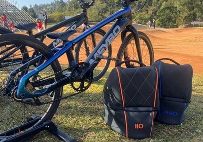 Remy Luxury Helmet Bag placed trackside, capturing the motorsport-inspired design in its natural 