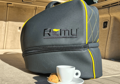Remy rain cover protecting helmet bag from rain, showing weatherproof fit and outdoor durability