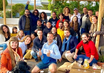 Group photo of Portimão Digital Nomads community at a meetup in Praia da Rocha, Portugal