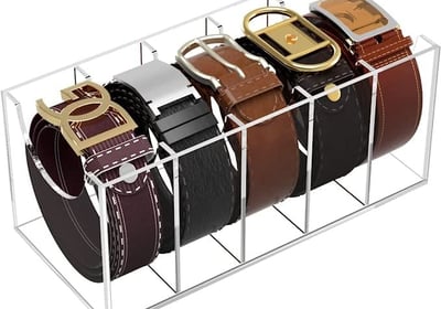 a display case with belts and belts on it