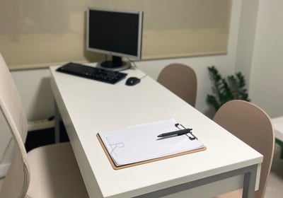 a desk with a computer and a keyboard