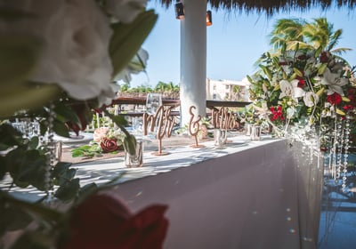 a table with a vase filled with flowers