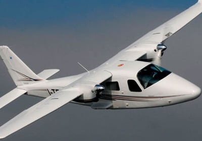 a small plane flying through the sky