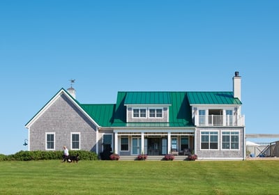 a photo of an east coast home with a green metal roof