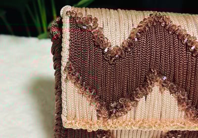 a purse with a heart shaped design on it, handmade handbag