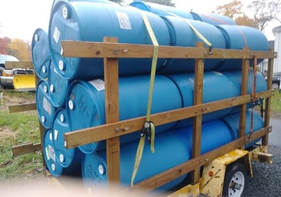 A trailer of upcycled plastic barrels