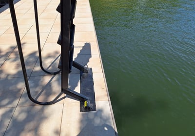 a boat dock with a ladder attached to it