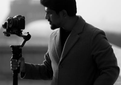 Videographer from Recits by Jegath filming with a gimbal, showcasing cinematic wedding