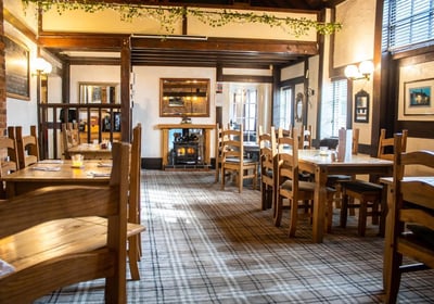 a pub restaurant with a fireplace