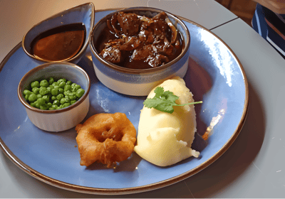 a plate with a bowl of food and a bowl of food