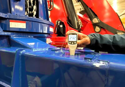 At our facility, we inspect blue paint thickness on a 5T truck mounted crane (crane truck) for durability & appearance.