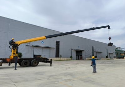 Our team's critical static/dynamic load test on a 10T telescopic truck crane ensures it meets stringent factory standards.