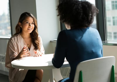 two women are talking