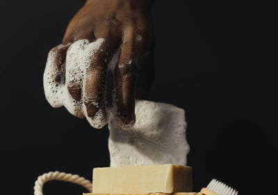 soapy hand with cleansers for sex toy hygiene