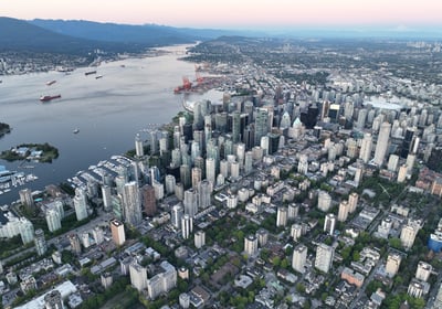 a cityscape of a large city with a river in the background
