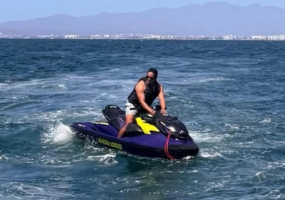a man riding a jet ski in the ocean