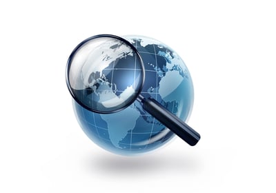 World globe and a magnifying glass