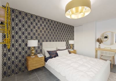 a bedroom with a bed and a desk with a lamp