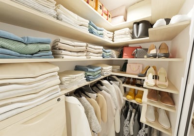 a closet with a lot of clothes and shoes