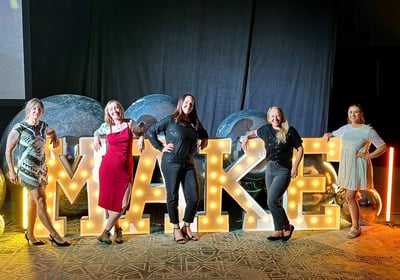 Women posing with Make Wellness Letters M.A.K.E.
