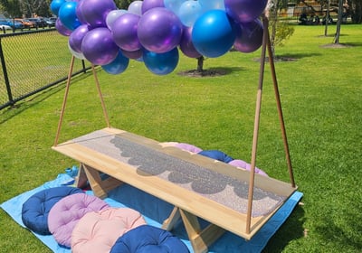 teepee picnic table hire frozen with balloon garland