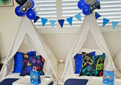 teepee slumber hire game night theme with balloon decorations and garland