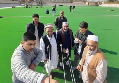 a group of men standing around a target