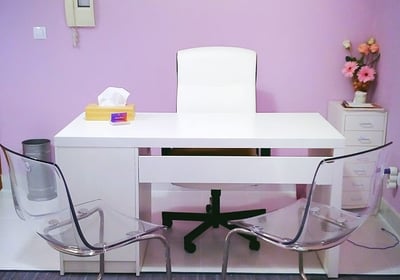 a desk with a chair and a desk with a chair