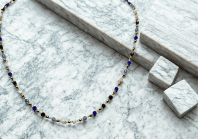 a necklace with a necklace and a necklace with a necklace