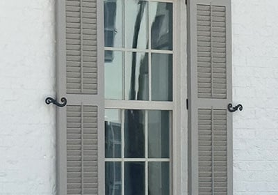 hinged exterior shutters that open and close