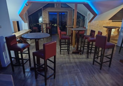 a bar with a bar stool and a bar stool