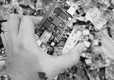 a person holding a cell phone in their hand