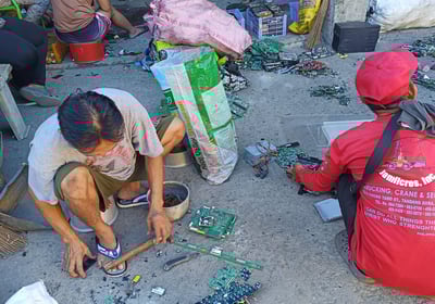 a man and woman are sitting on the ground
