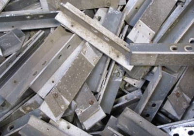 a pile of metal steel beams and some metal