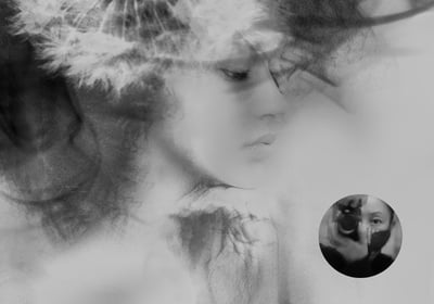 Dreamlike black and white portrait by Thuan Anh Nguyen, blending soft textures with a woman's face.