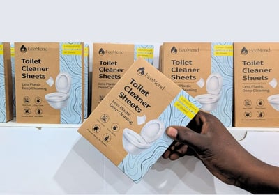 picking a box of ecomend toilet cleaner sheets from a shop